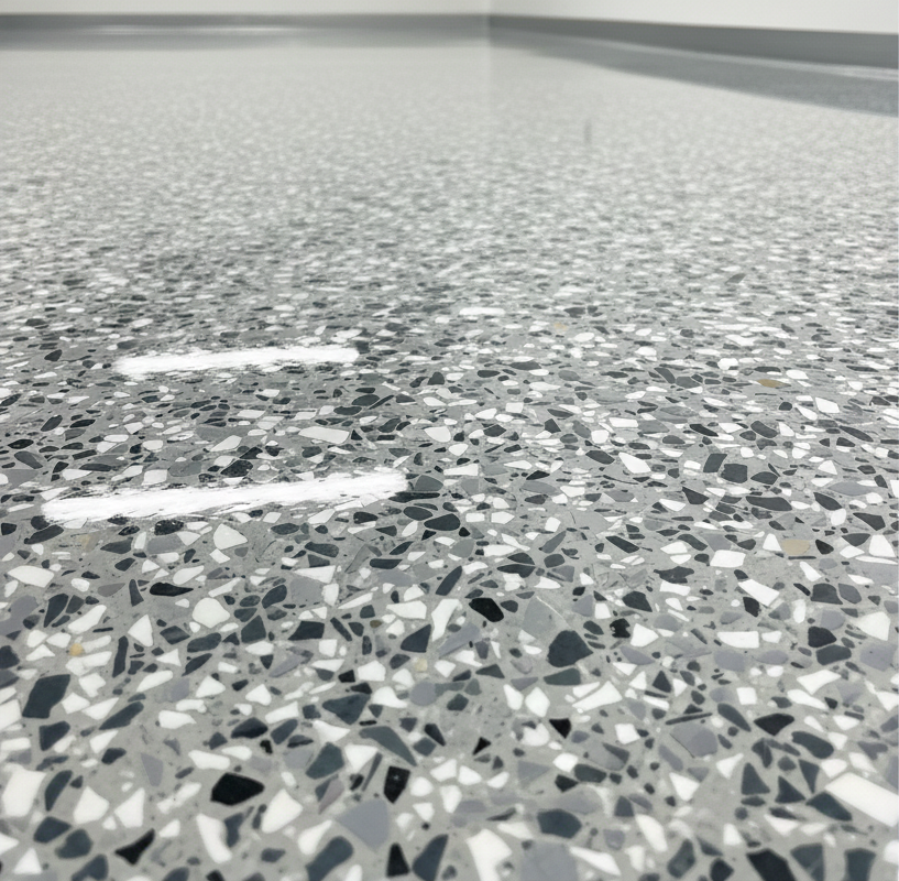 Close-up of decorative multi-colored flake epoxy floor finish by Ironside Epoxy